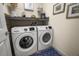Convenient laundry room with full-size washer and dryer units at 10521 Amberjack Way # 303, Englewood, FL 34224