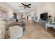 Spacious living room featuring tile floors, neutral colors, comfortable seating and open layout at 10521 Amberjack Way # 303, Englewood, FL 34224