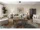 Inviting living room featuring comfortable seating, a decorative rug, and neutral tones for a relaxing atmosphere at 10521 Amberjack Way # 303, Englewood, FL 34224