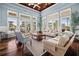 Interior lobby with hardwood floors, several chairs, and lots of natural light at 10521 Amberjack Way # 303, Englewood, FL 34224