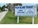 Palm Island Transit sign announcing normal operations with contact information at 10521 Amberjack Way # 303, Englewood, FL 34224