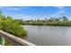 Beautiful view of a river and lush green vegetation, blending nature with community living at 10521 Amberjack Way # 303, Englewood, FL 34224