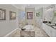 Luxury bathroom with soaking tub, marble tiling and dual vanity sinks at 124 Cutlass Dr, Rotonda West, FL 33947