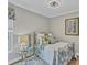 Cozy bedroom with metal bedframe and natural light at 124 Cutlass Dr, Rotonda West, FL 33947