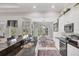 Kitchen with granite countertops overlooking dining room and backyard at 124 Cutlass Dr, Rotonda West, FL 33947