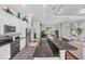 Open concept kitchen with granite counters, stainless steel appliances and breakfast bar at 124 Cutlass Dr, Rotonda West, FL 33947