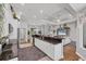Spacious kitchen with granite counters and white cabinetry overlooking the living room at 124 Cutlass Dr, Rotonda West, FL 33947