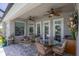 This beautiful patio has a seating area and table for outdoor dining and enjoyment at 124 Cutlass Dr, Rotonda West, FL 33947