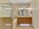 Elegant bathroom with a walk-in shower, large soaking tub, and double vanity at 13051 Creekside Ln, Port Charlotte, FL 33953