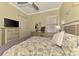 Bright bedroom with an accent wall, tv, neutral decor, and a large window for ample natural light at 13051 Creekside Ln, Port Charlotte, FL 33953