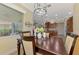 Inviting dining room with a dark wood table, stylish chairs and lots of natural light at 13051 Creekside Ln, Port Charlotte, FL 33953
