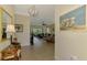 Foyer area leading to living room with tile floors and neutral wall colors at 13051 Creekside Ln, Port Charlotte, FL 33953