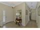 Bright foyer with tile flooring, console table, and view of hallway at 13051 Creekside Ln, Port Charlotte, FL 33953