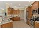 Spacious kitchen featuring granite countertops, stainless steel appliances, and ample cabinet space at 13051 Creekside Ln, Port Charlotte, FL 33953