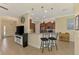 Kitchen with stainless steel appliances, granite countertops, breakfast bar seating, and tile flooring at 13051 Creekside Ln, Port Charlotte, FL 33953