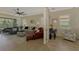 Bright living room with comfortable seating and view to screened outdoor space at 13051 Creekside Ln, Port Charlotte, FL 33953