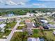 This aerial view showcases the single story home with the lawn and landscaping at 1337 Le Pera Rd, Englewood, FL 34223