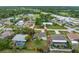 This aerial view showcases the single story home with the lawn and landscaping at 1337 Le Pera Rd, Englewood, FL 34223
