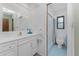 Bright bathroom featuring a vanity, sink, toilet and walk in shower at 1337 Le Pera Rd, Englewood, FL 34223