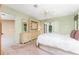 Bedroom featuring a ceiling fan and a full set of furniture and sliding door access at 1337 Le Pera Rd, Englewood, FL 34223
