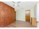 Bedroom displaying a built-in wardrobe, wood laminate flooring, and standard closet at 1337 Le Pera Rd, Englewood, FL 34223