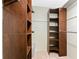 Walk-in closet with custom shelving and ample storage space at 1337 Le Pera Rd, Englewood, FL 34223