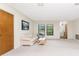 Spacious living room with carpet flooring, bright windows, and ample natural light at 1337 Le Pera Rd, Englewood, FL 34223