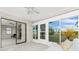 Enclosed sunroom offering views of the backyard at 1337 Le Pera Rd, Englewood, FL 34223