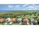 Beautiful aerial view of a well-maintained community that sits next to a beautiful marsh with a golf course at 13376 Golf Pointe Dr, Port Charlotte, FL 33953