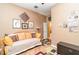 Bedroom with a daybed, wood floors and access to other rooms at 13376 Golf Pointe Dr, Port Charlotte, FL 33953