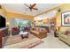 Spacious living room with an open layout that flows to the kitchen and dining area at 13376 Golf Pointe Dr, Port Charlotte, FL 33953
