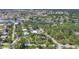 Aerial shot showcases this home's location within a lush, green residential area near waterways at 1550 Bayshore Dr, Englewood, FL 34223