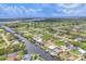 Expansive aerial view capturing waterfront community, waterways, and the lush green landscape around at 15610 Staunton Cir, Port Charlotte, FL 33981