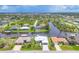 An aerial view of waterfront homes with canals, lush greenery, and serene water views at 15610 Staunton Cir, Port Charlotte, FL 33981