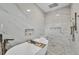 Luxurious bathroom features a soaking tub, rainfall shower, and marble tile surround at 15610 Staunton Cir, Port Charlotte, FL 33981