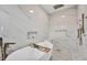 Inviting bathroom with elegant soaking tub, rainfall showerhead, and marble accents at 15610 Staunton Cir, Port Charlotte, FL 33981