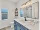Bathroom features a modern vanity with marble countertop and a window with natural light at 15610 Staunton Cir, Port Charlotte, FL 33981