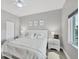 Cozy bedroom features a comfortable queen-sized bed, modern decor, and a ceiling fan at 15610 Staunton Cir, Port Charlotte, FL 33981