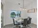 Bright dining room with modern table set and a scenic view of the water at 15610 Staunton Cir, Port Charlotte, FL 33981