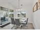 Modern dining room with view of the water and outdoor patio at 15610 Staunton Cir, Port Charlotte, FL 33981
