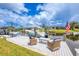 Waterfront property featuring a private dock with a boat and outdoor seating at 15610 Staunton Cir, Port Charlotte, FL 33981