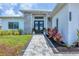 A lovely, stone walkway leads to the home's double door entry with decorative wreaths at 15610 Staunton Cir, Port Charlotte, FL 33981