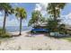 Kayaks on the beach with rentals available, surrounded by palm trees and sandy shores at 15610 Staunton Cir, Port Charlotte, FL 33981