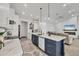 Spacious kitchen with island, stainless appliances, open to living room with fireplace at 15610 Staunton Cir, Port Charlotte, FL 33981