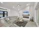 Open concept living room with modern fireplace, TV, and comfortable seating at 15610 Staunton Cir, Port Charlotte, FL 33981