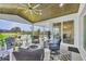 Inviting outdoor patio with comfortable seating, fire pit, and serene waterfront views at 15610 Staunton Cir, Port Charlotte, FL 33981