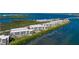 Stunning aerial view of waterfront condo community with a pool at 1591 Beach Rd # 402, Englewood, FL 34223