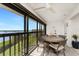 Enclosed balcony with dining table provides stunning water views at 1591 Beach Rd # 402, Englewood, FL 34223