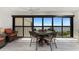 Enclosed balcony with dining table offers scenic water views at 1591 Beach Rd # 402, Englewood, FL 34223