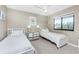 Charming bedroom with coastal décor, featuring twin beds and beach-themed artwork at 1591 Beach Rd # 402, Englewood, FL 34223